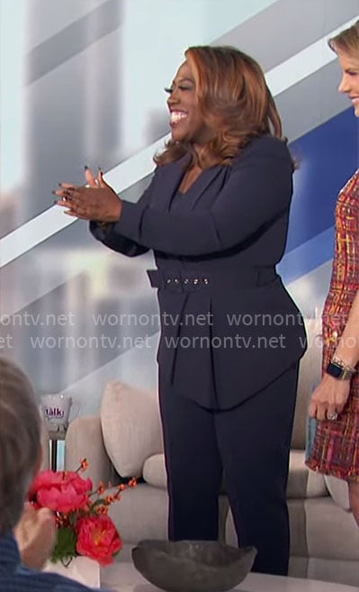 Sheryl’s navy asymmetric blazer on The Talk