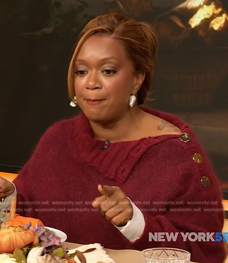 Sunny Anderson’s red gold button shoulder sweater on The Drew Barrymore Show