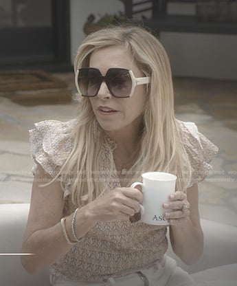 Sutton's print ruffle top and sunglasses on The Real Housewives of Beverly Hills