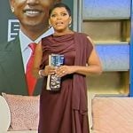 Tamron’s burgundy drape satin top and skirt on Tamron Hall Show