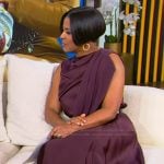 Tamron’s burgundy drape satin top and skirt on Tamron Hall Show