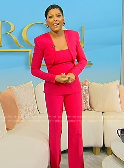 Tamron's pink peplum blouse and pants on Tamron Hall Show