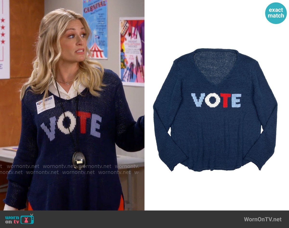 Wooden Ships Vote Navy V-neck Sweater worn by Gemma (Beth Behrs) on The Neighborhood