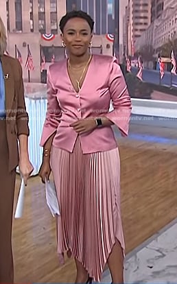 Zinhle’s pink satin jacket and pleated skirt on NBC News Daily