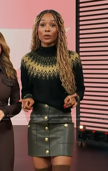 Zuri’s black argyle knit sweater and leather mini skirt on Access Hollywood