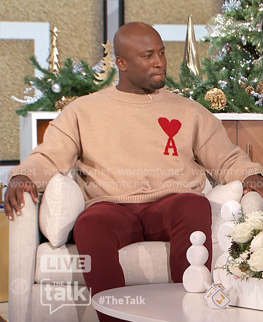 Akbar’s camel sweater with heart on The Talk