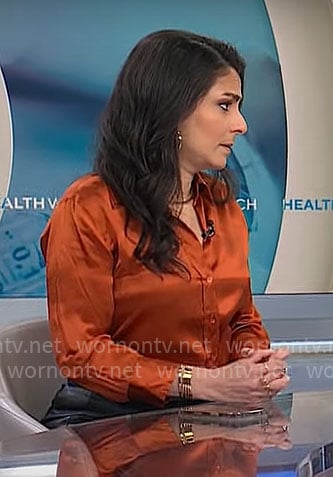 Dr Celine Gounder’s orange button down blouse on CBS Mornings