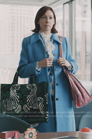 Elsbeth’s blue coat and zebra tote on Elsbeth