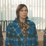 Elsbeth’s plaid tie neck blouse and blue plaid coat on Elsbeth