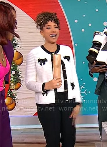 Gabrielle Kerr's white cardigan with black bows on CBS Mornings