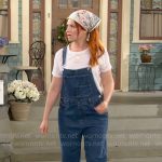 Gemma’s denim overalls and lips tee on The Neighborhood