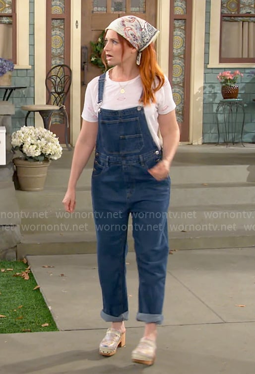 Gemma’s denim overalls and lips tee on The Neighborhood