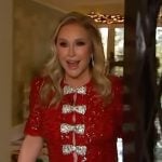 Kathy Hilton’s red bow embellished mini dress on Access Hollywood