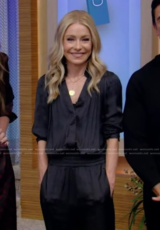 Kelly's black satin jumpsuit and yellow pumps on Live with Kelly and Mark