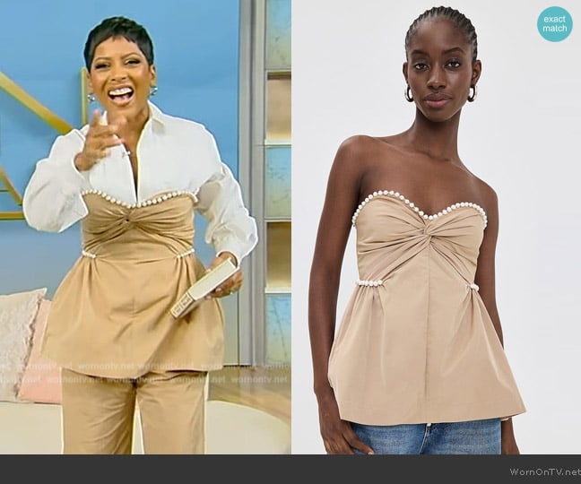 Tamron’s khaki pearl trim top on Tamron Hall Show