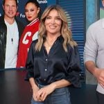 Kit’s black satin top and jeans on Access Hollywood