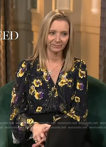 Lisa Kudrow’s black floral print blouse on Access Hollywood