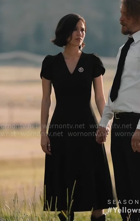 Monica's black v-neck funeral dress on Yellowstone