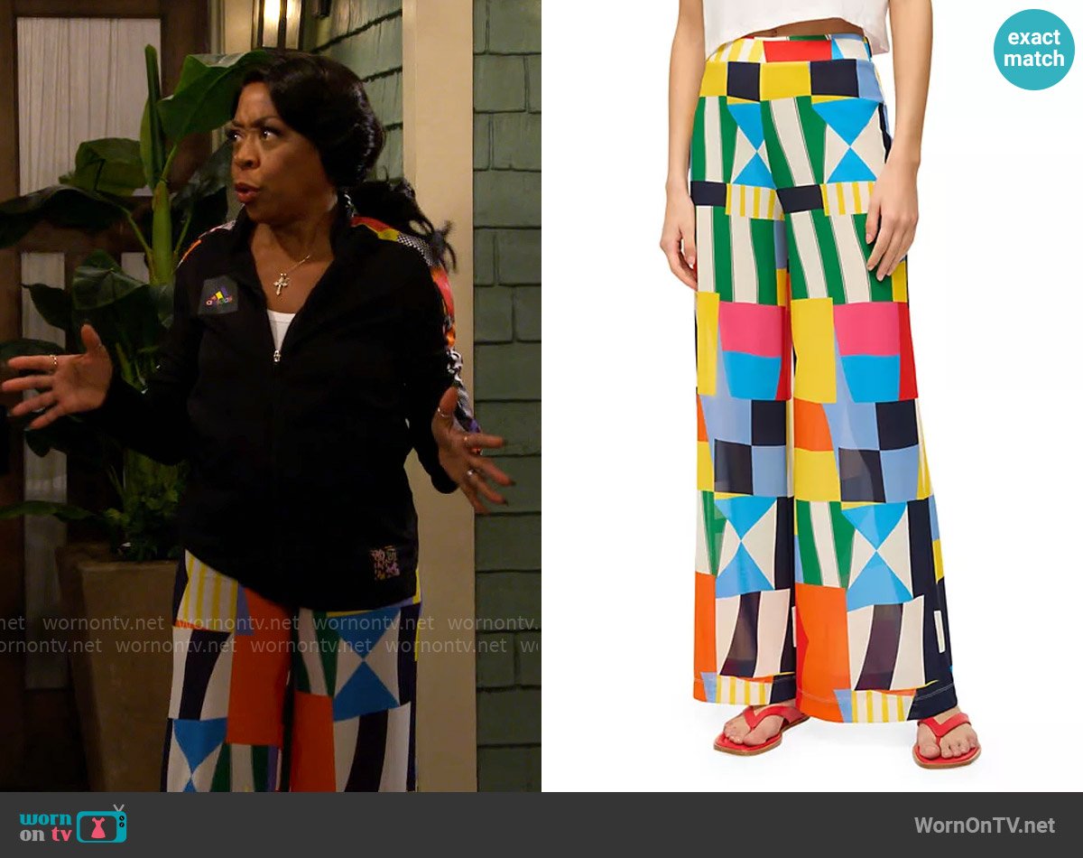 Tina’s colorful geometric print pants on The Neighborhood