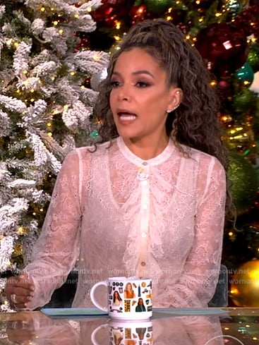 Sunny’s white lace ruffle blouse on The View