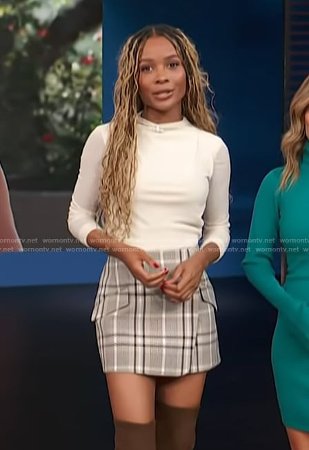 Zuri’s plaid mini skirt on Access Hollywood