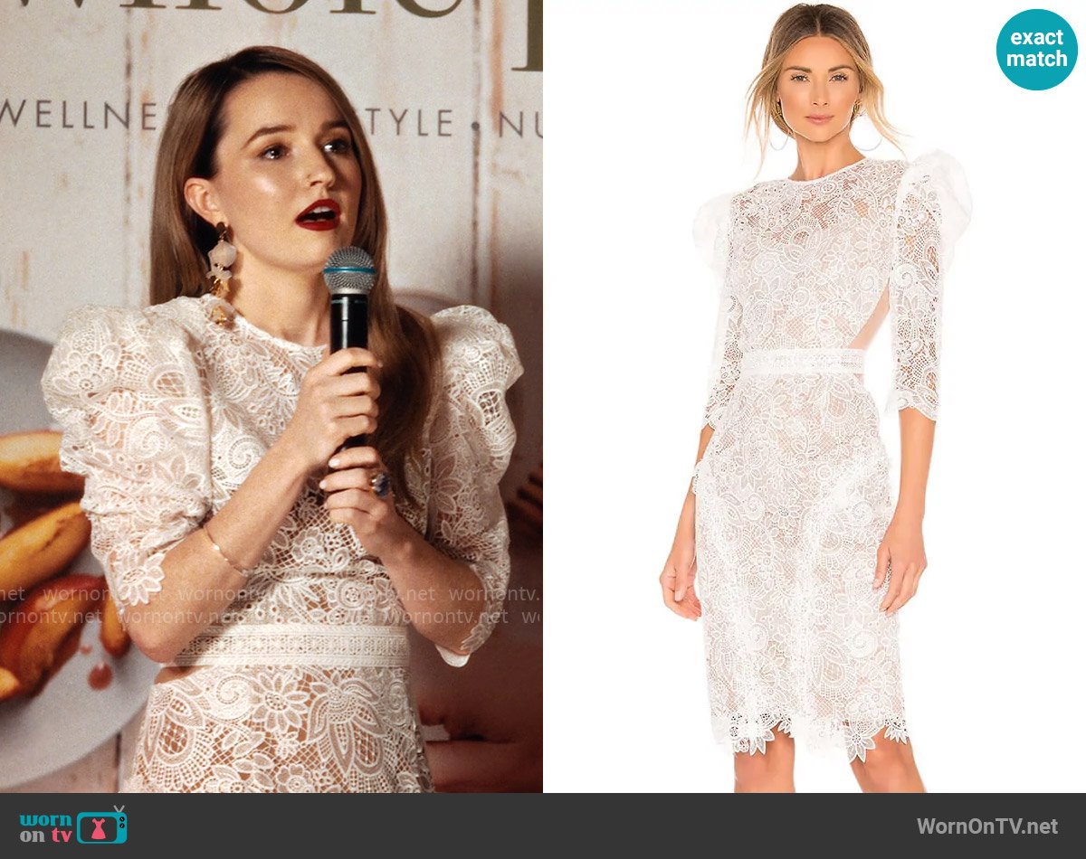 Belle’s white lace puff-sleeve dress on Apple Cider Vinegar