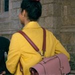 Bela's pink colorblock backpack on The Sex Lives of College Girls