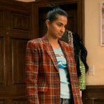 Bela’s red plaid blazer and rainbow graphic tee on The Sex Lives of College Girls