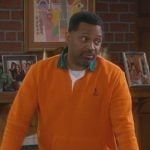 Bennie’s orange contrast polo sweater on The Upshaws