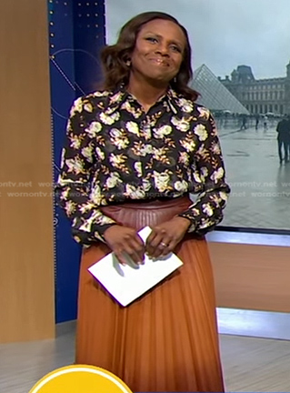 Deborah’s black floral blouse and brown ombre pleated skirt on Good Morning America