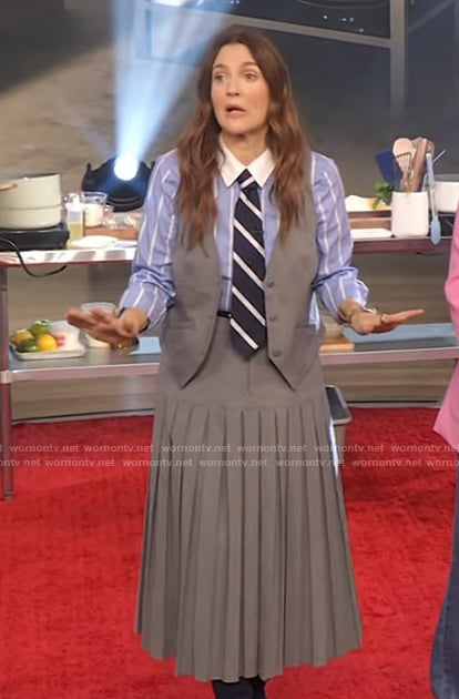 Drew’s blue stripe shirt and pleated skirt on The Drew Barrymore Show