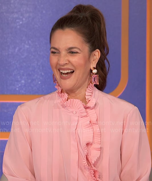 Drew Barrymore's pink pleated ruffle blouse on Hollywood Squares