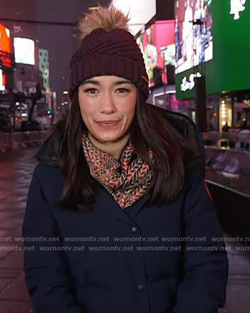 Emilie’s navy down coat and purple knit beanie on Today