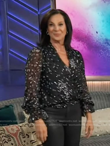 Emily Kaufman's black dotted sheer wrap top on The Kelly Clarkson Show