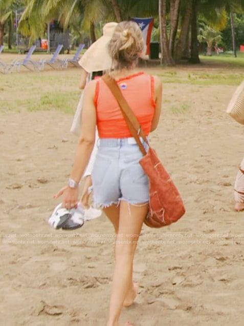 Erin's orange ruffle trim top on The Real Housewives of New York City