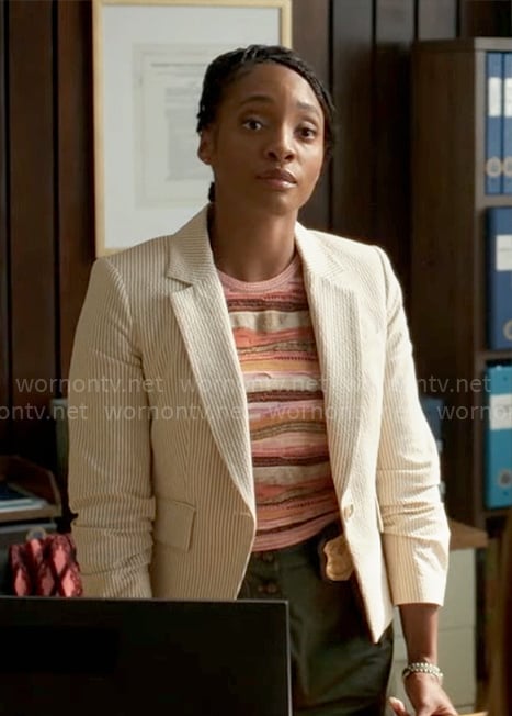 Faith's beige striped seersucker blazer, wavy knit top and green pants on Will Trent