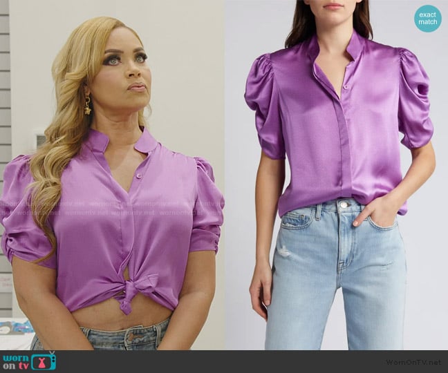 Gizelle’s purple satin short sleeve blouse on RHOP