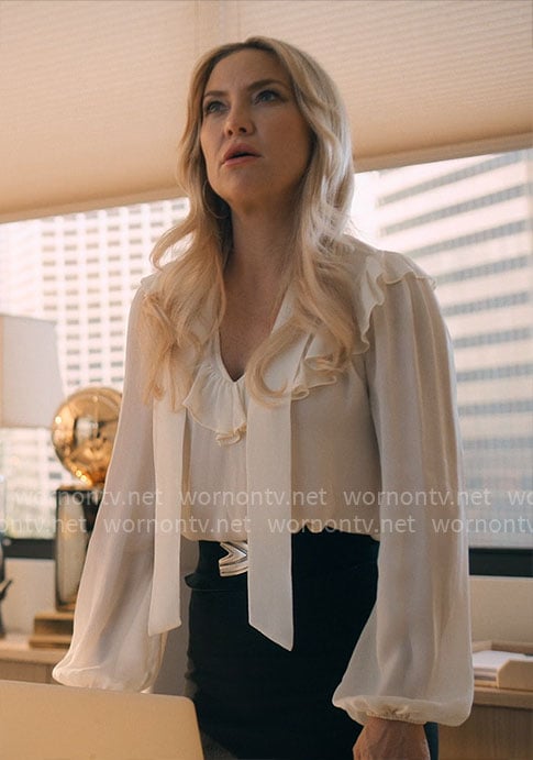 Isla's white ruffled tie-neck blouse on Running Point