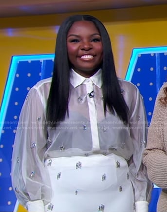 Joaquina’s white embellished sheer blouse and pencil skirt on Good Morning America