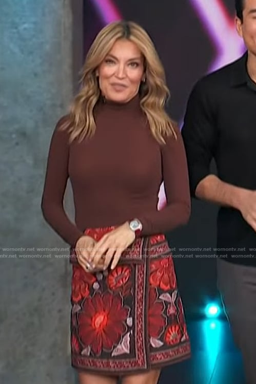 Kit’s red floral embroidered mini skirt on Access Hollywood