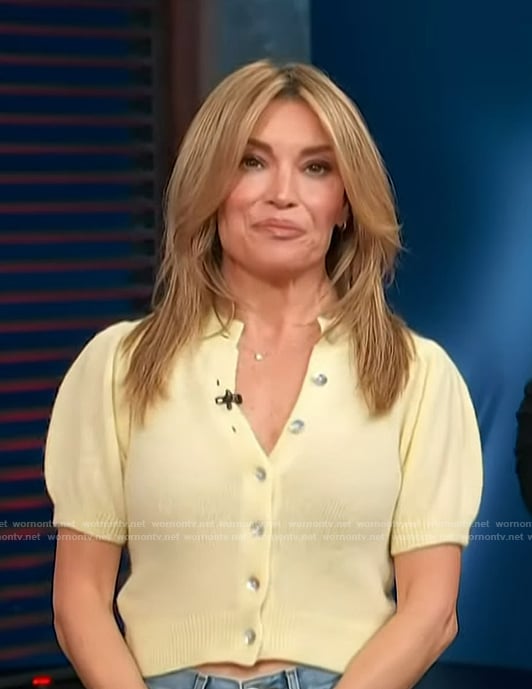 Kit's yellow cardigan and jeans on Access Hollywood