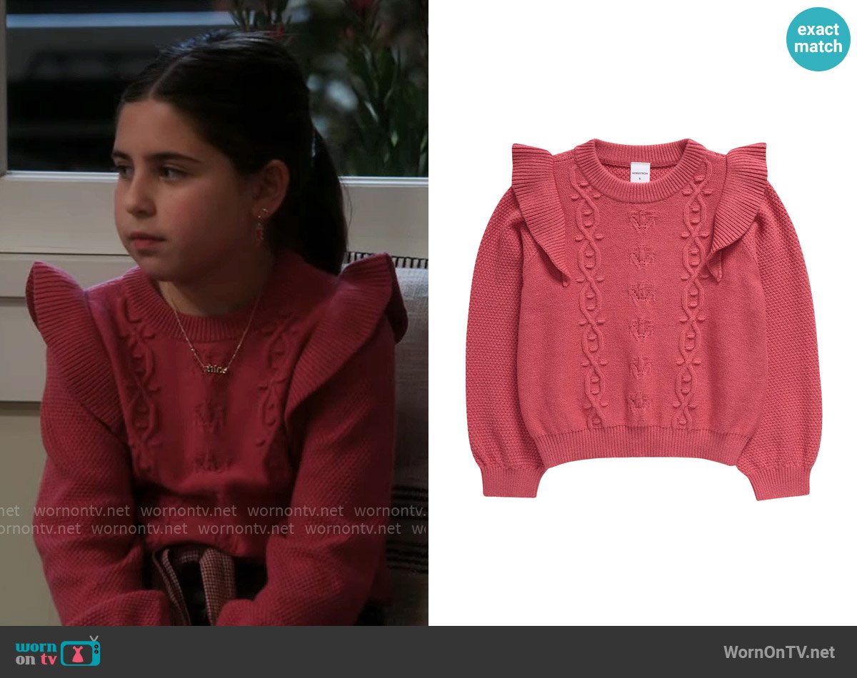 Georgia’s pink ruffle-shoulder sweater on Shifting Gears