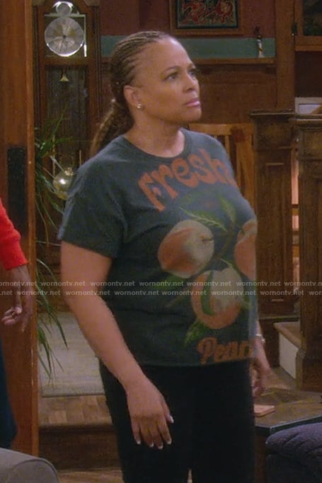 Regina's peach graphic tee on The Upshaws