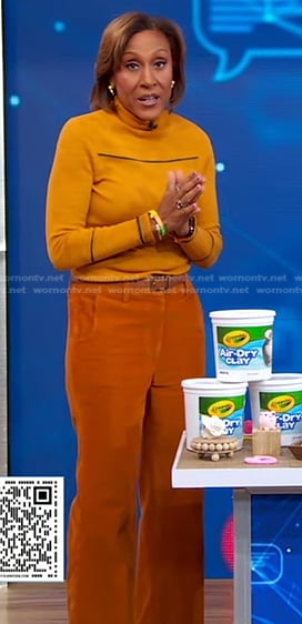 Robin’s orange turtleneck and corduroy pants on Good Morning America