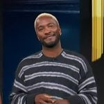 Scott’s striped oversized sweater on Access Hollywood