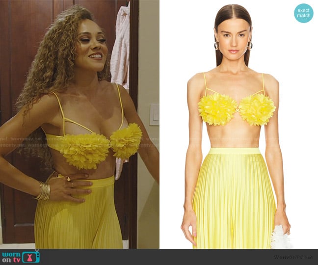 Ashley’s yellow pleated pants on RHOP