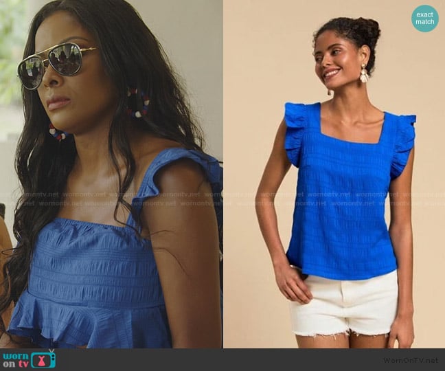 Stacey’s blue ruffle top on RHOP