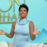 Tamron’s blue ruffle neck dress on Tamron Hall Show