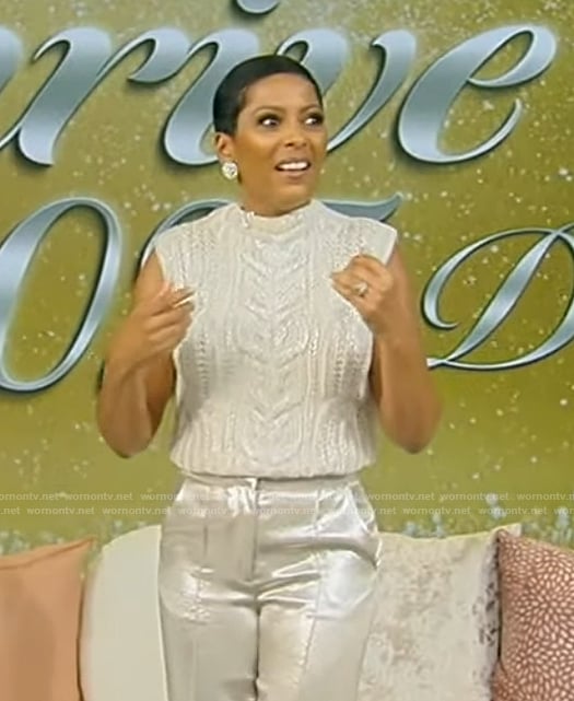 Tamron’s white cable knit vest and pants on Tamron Hall Show