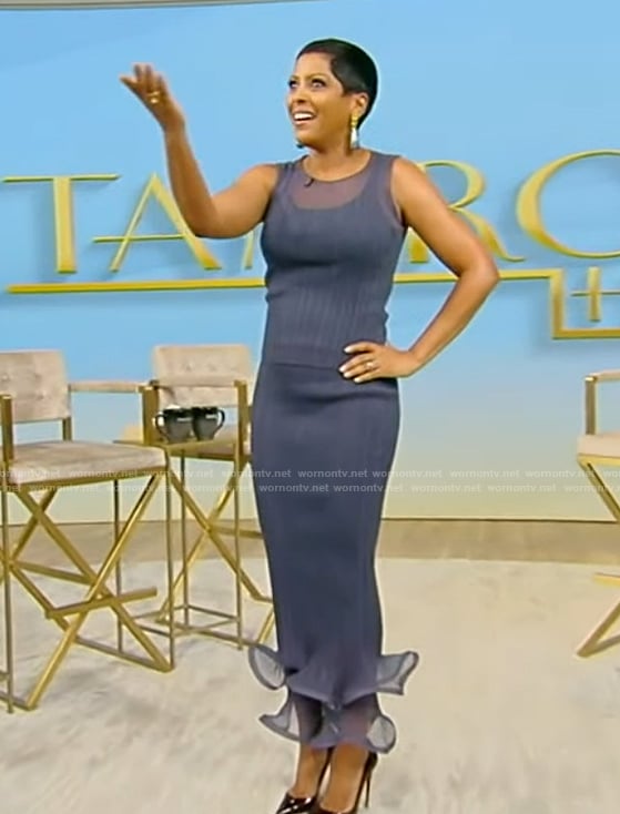 Tamron's blue sheer top and ruffle hem skirt on Tamron Hall Show